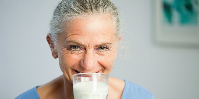 woman smelling milk
